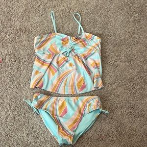 This is a wonder nation bathing suit the color is multi color and is a size14/16